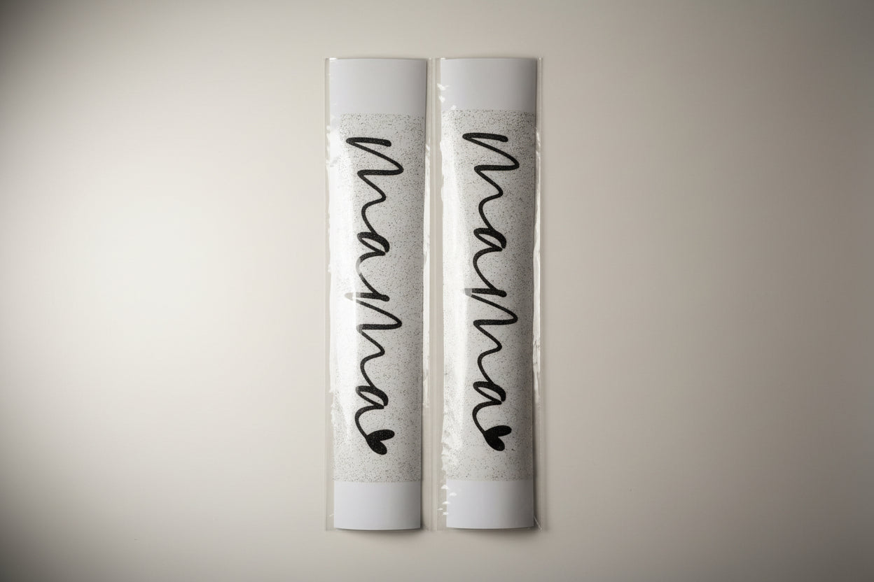 Two rolls of decorative heat transfer vinyl with 'mama' text and heart design on a white background.