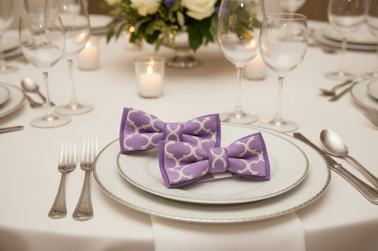 Two purple bow-ties with pattern and print mix.